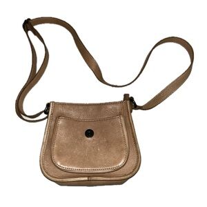 Tanish brown leather crossbag with adjustable strap and magnet snap.